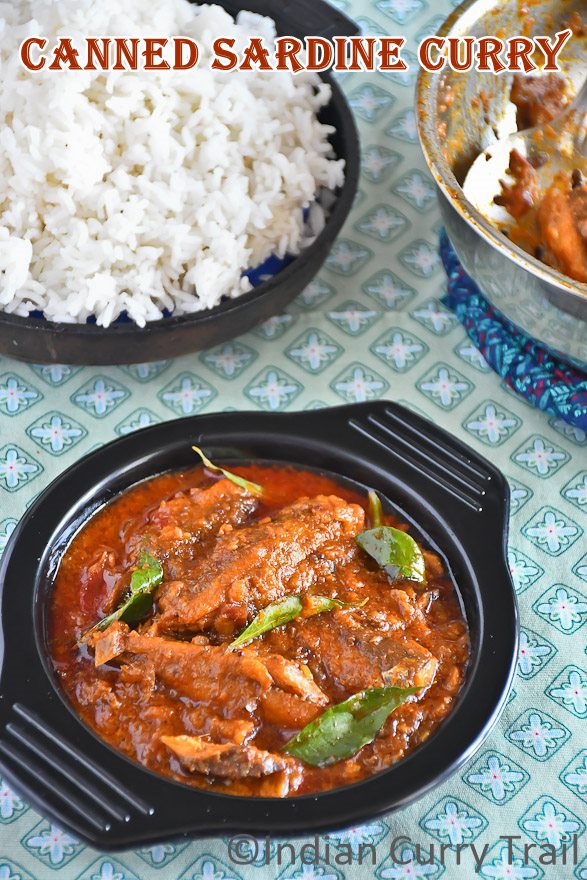 Indian style canned sardine curry served in a bowl with steamed rice in the behind